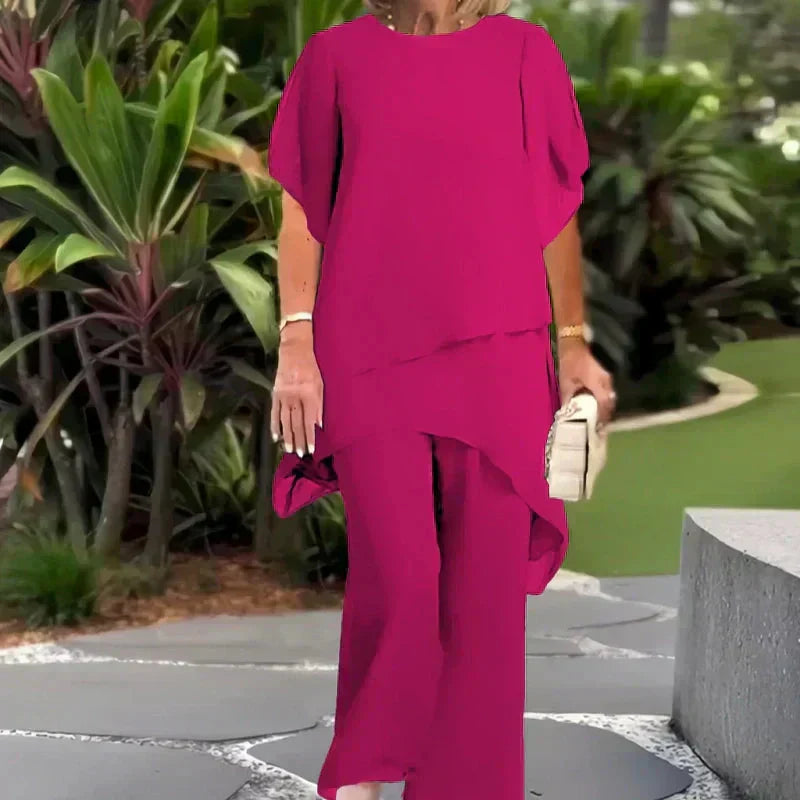 Almudena - Conjunto top de corte irregular y pantalones de pierna ancha.