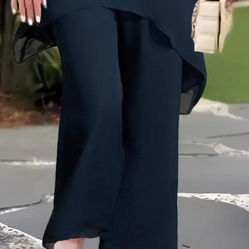 Almudena - Conjunto top de corte irregular y pantalones de pierna ancha.